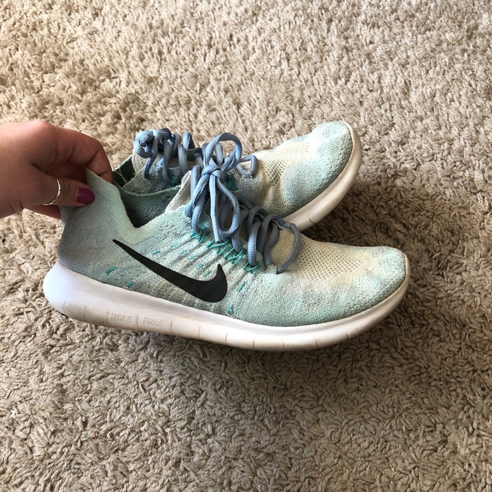 Teal flyknit Nike sneakers